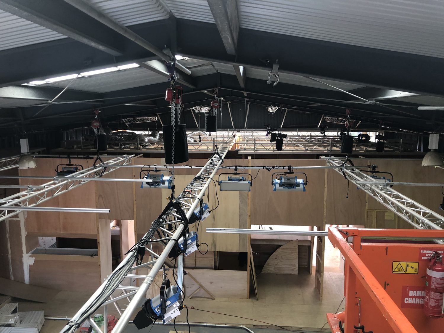 LX truss lighting grid installed over a set build